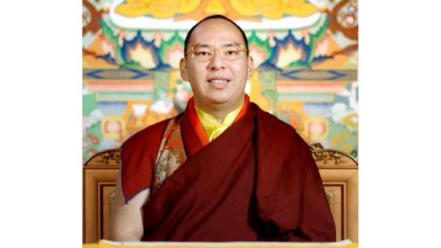 The false 11th Panchen Lama, Gyaincain Norbu. Credits.